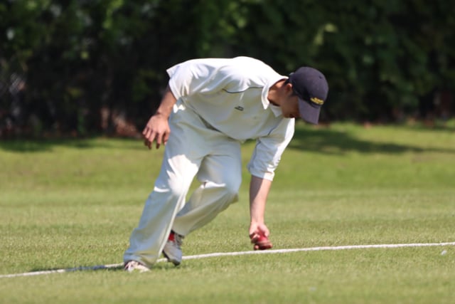 A Sewerby fielder stops a boundary at Bridlington CC 2nds.