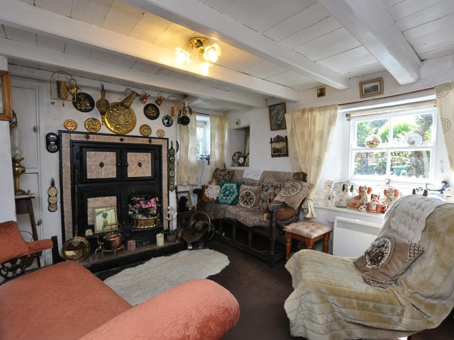 The snug, beamed sitting room within the cottage.