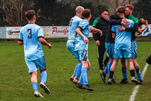 Newby celebrate during their late cup win against Scalby in the Saturday League Cup.