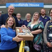 Staff at Saint Cecilia’s and hospitals with one of the hampers.