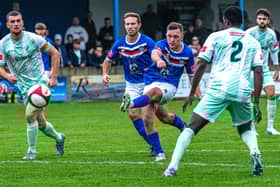 Joseph Gibson shoots for Whitby Town at home to Matlock Town. Photo by Brian Murfield
