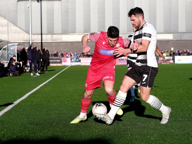 Seadogs captain Michael Coulson looks to evade the attentions of Darlington's Ben Hedley.