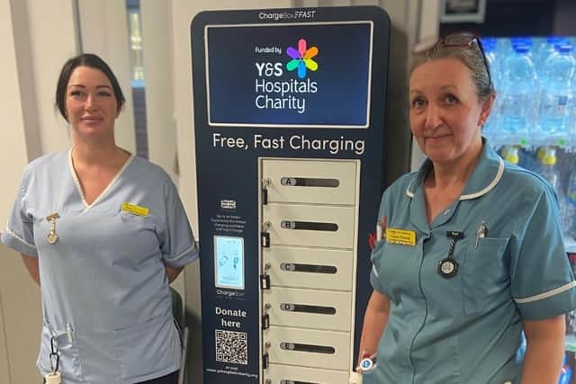 Sara Shearing, Senior Health Care Assistant and Karroll Powell, Associate Nurse Practitioner with one of the new mobile phone charging units.