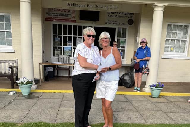 Brid Bay Secretary Christine Knott, left, presents the runners-up cheque to Jo Leeman at the Over-60s Singles Merit.