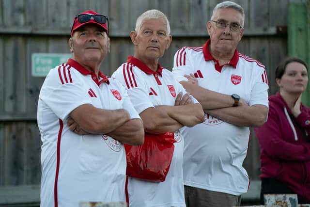 Three Boro fans watch the action at Mill Lane on Friday night. Photo by Wandering Photography