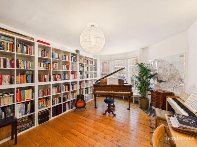 The study and music room also has a bay window, and a wooden floor.