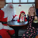 Seven-year-old Ashleigh meets Santa on the North Yorkshire Moors Railway.