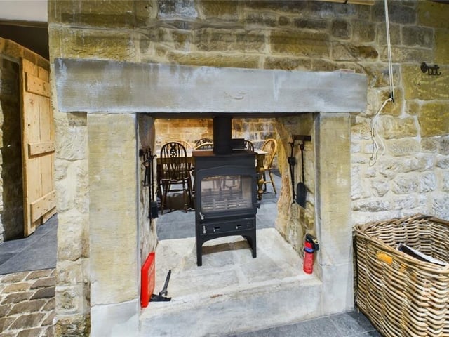 The double-faced stone firpace with woodburning stove.