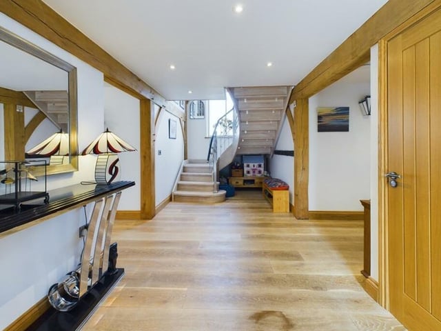 The spacious hallway with bespoke staircase.