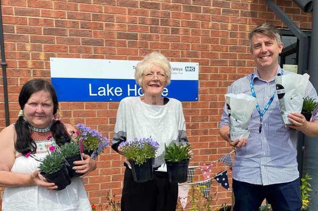 L-R Karen Dickinson, Judith Webster and Matt Bower help out the gardening group with some planting.