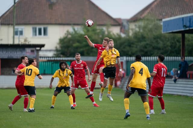 Brid Town challenge for a header against Bradford PA. Photo by Wandering Photography