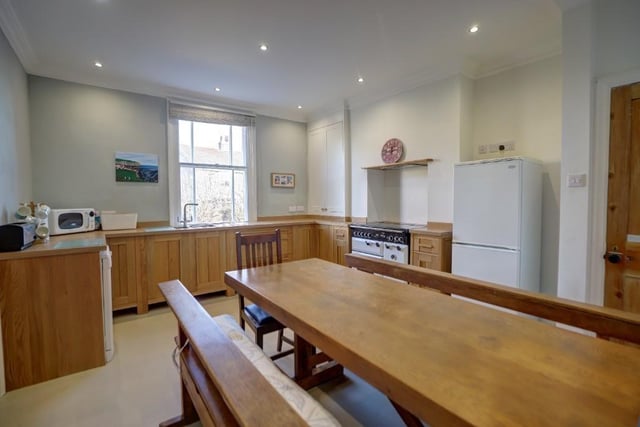 The spacious dining kitchen, with fitted oak units.