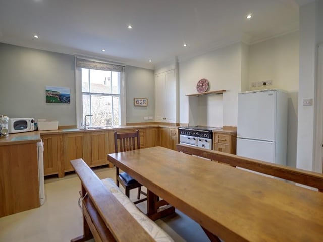 The spacious dining kitchen, with fitted oak units.