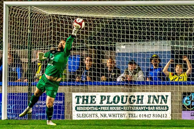 Keeper Shane Bland pulls off a spectacular save for the home side Whitby Town