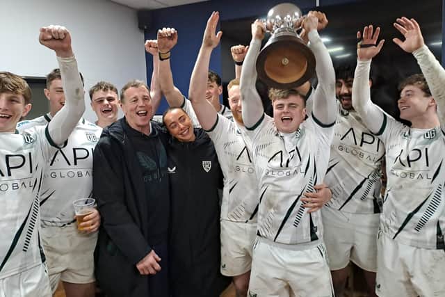 Winners Old Grovians lift the Fowler Trophy at the Good Friday Pock 7s.
