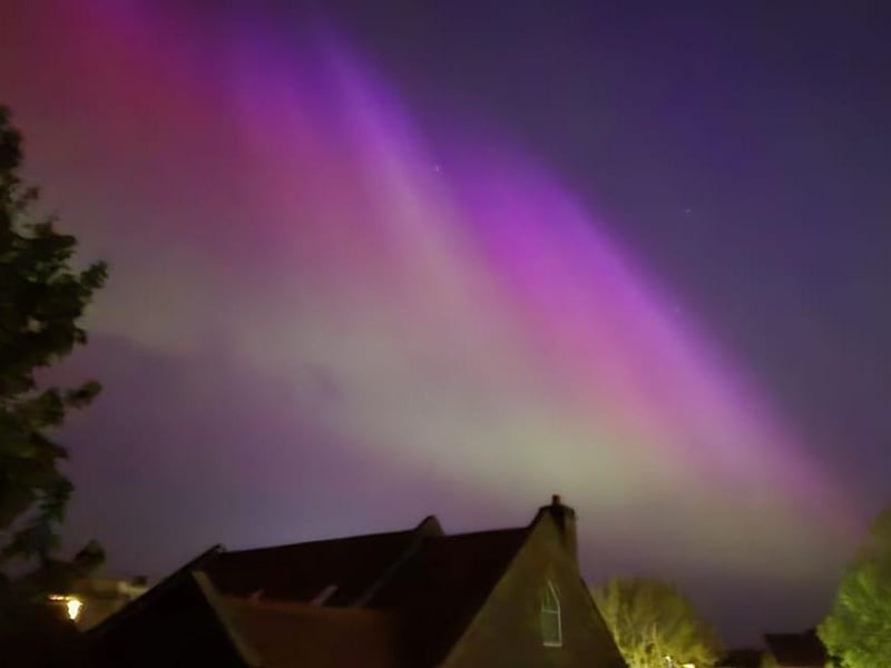 Stunning colours of the aurora over the rooftops.picture by Kelly Brown.