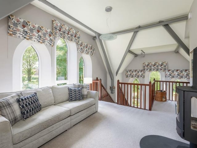 This siting room's windows have lovely views.
