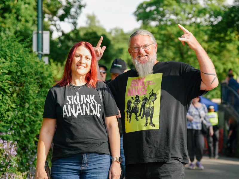 Fans wearing band merch, ready to watch the iconic 90's bands.