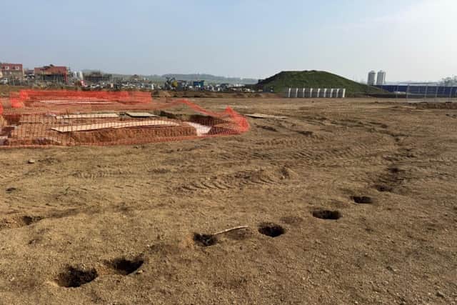 Close up of the post holes with construction work in the background - Image: Cllr Robert Peacock