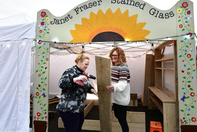 Setting up for Whitby's Christmas Festival....stained glass artist Janet Fraser and Tracie Weatherill get ready.
picture: Richard Ponter.