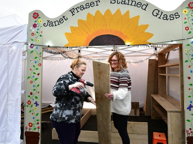 Setting up for Whitby's Christmas Festival....stained glass artist Janet Fraser and Tracie Weatherill get ready.
picture: Richard Ponter.