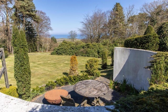 A seating area with a view down to the sea.