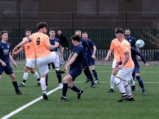 Edgehill skipper Joe Gallagher aims a header at the Haxby goal