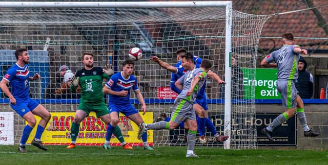 Ashley Jackson (far right number 3) scores 93rd minute winner for Gainsborough at Whitby. PHOTOS BY BRIAN MURFIELD