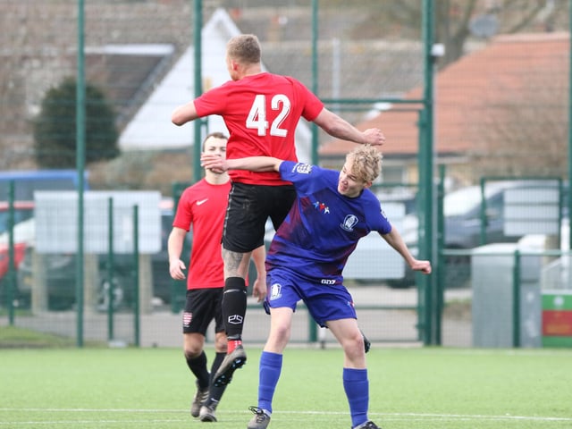 Club Atletico de Bransholme and hosts Brid Rovers Pandas fight it out for the ball in the air.