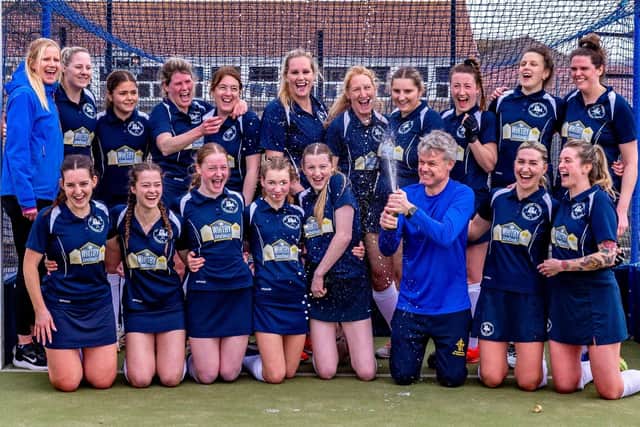 Whitby Hockey Club Ladies celebrate clinching YNE North East Women’s Division 2 title with win on final day of the league season with a bottle of champagne