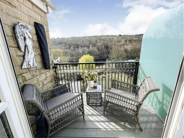 A balcony with river views from this first floor flat in Sowerby Bridge.