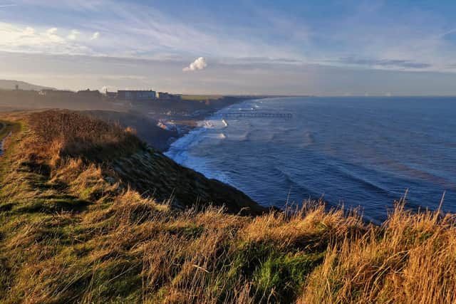 View towards Saltburn and its piers.