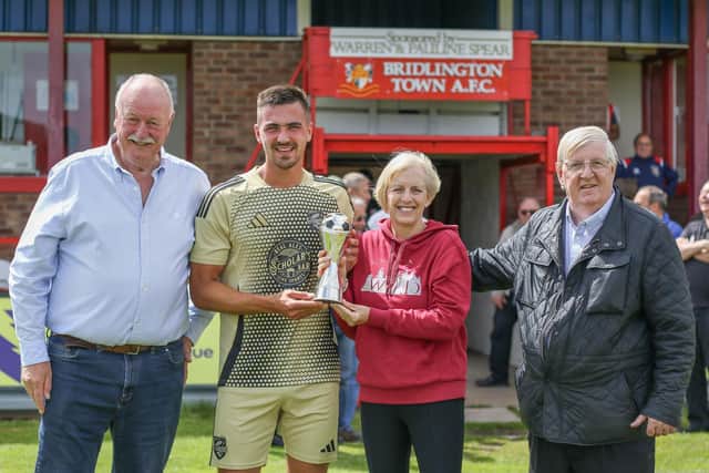 Boro skipper Will Thornton is presented with the Dave Holland Trophy. PHOTOS BY MORGAN EXLEY