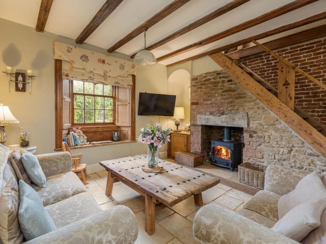 This cosy sitting room in The Old Hall has a window seat.