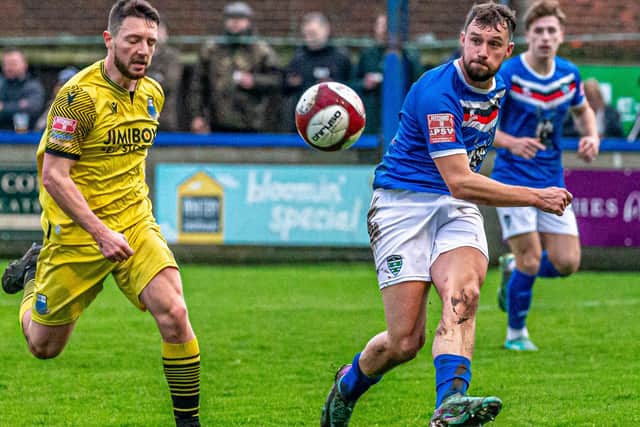 Town's Lewis Hawkins in action. PHOTOS BY BRIAN MURFIELD