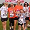 The Trown family line up with Paula Radcliffe.