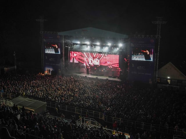 The sold-out show had 8,000 fans packed into the open-air venue.
