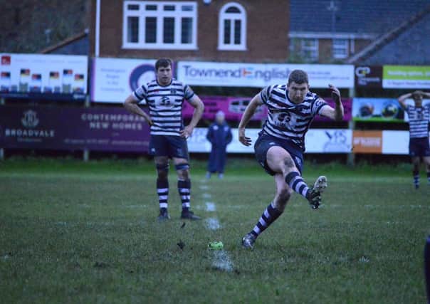 Christian Pollock kicks one of his two penalties to seal Pocklington RUFC's win at home to West Leeds. PHOTO BY ANDY NELSON