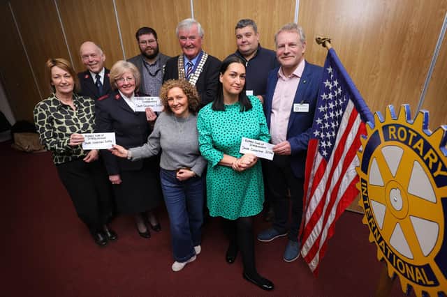 Rotary representatives Roger Cannon and Andy Nattrass present cheques to local organisations FutureWorks, The Salvation Army, The Boys Brigade, The Ymca and Bradley Lowery at Scarborough Rugby Club pic Richard Ponter