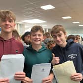 Henry, Max and Michael celebrate their results