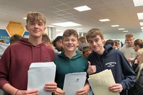 Henry, Max and Michael celebrate their results