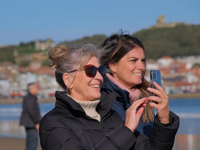 Spectators capture the moment