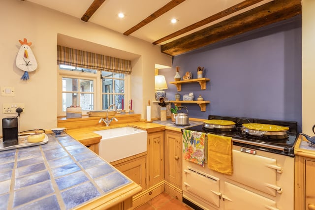 A bespoke kitchen with an aga oven.