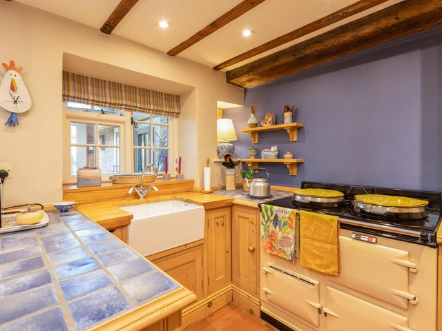 A bespoke kitchen with an aga oven.