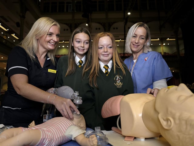 Hospital staff Claire Jackson and Jenny Ware with Lady Lumley's pupils on their medical stand
