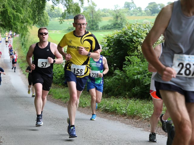 Bridlington Road Runner Graham Lonsdale works his way uphill during the Top of the Wolds 10K event.