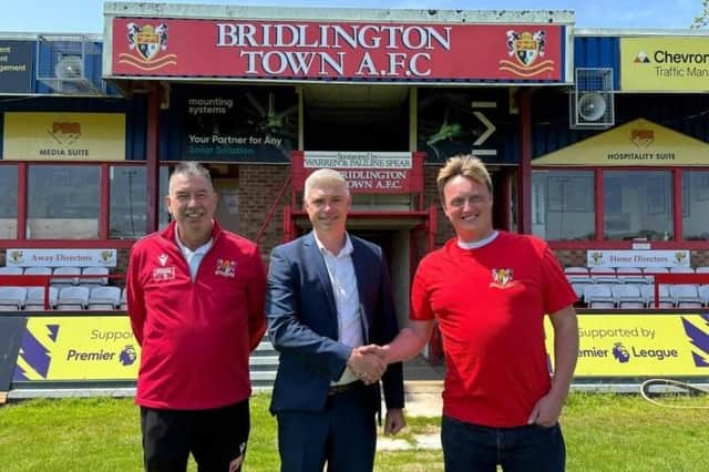Steve Brennan, centre, is welcomed by Bridlington Town chairman Daniel Rogers, right, as the new Chief Executive Officer to replace Gavin Branton, left.