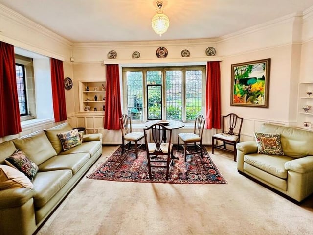 A stunning sitting room with views of the garden.