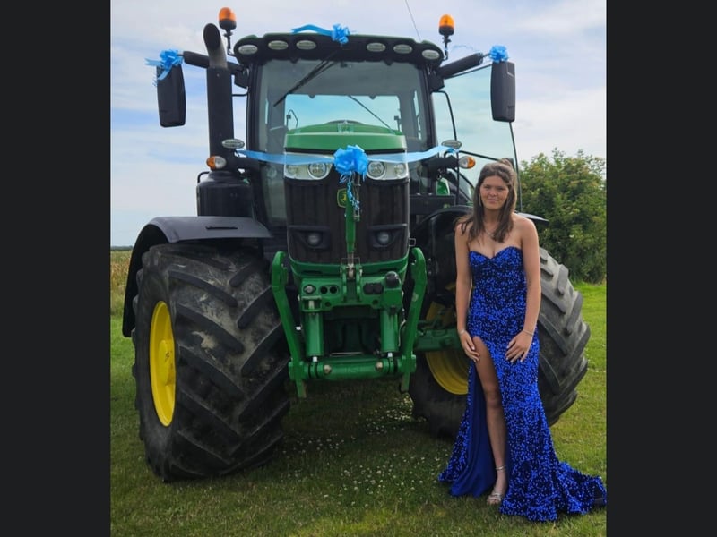 Brooke Waites looking lovely with her transport to prom, which is almost as dolled up as she is!
