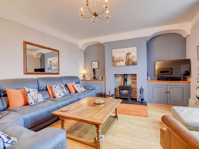 A warming stove is a focal point in the bright and comfortable lounge.